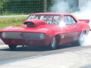 Red 1969 CAMARO Doing Burnout